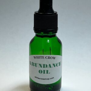 Green bottle of White Crow Abundance Oil.