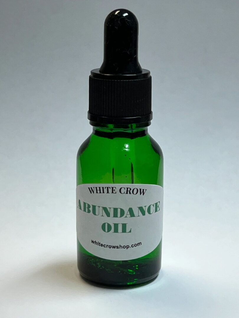 Green bottle of White Crow Abundance Oil.