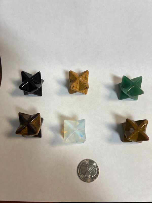 Six crystal Merkaba star shapes.