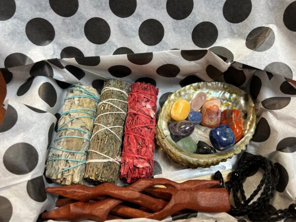 Gift box with smudge sticks and crystals.