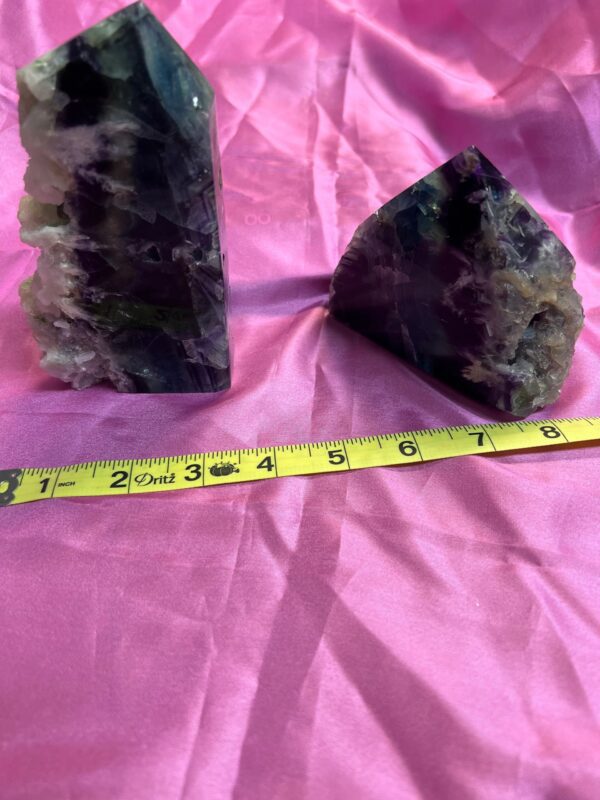 Two purple and green fluorite crystals.