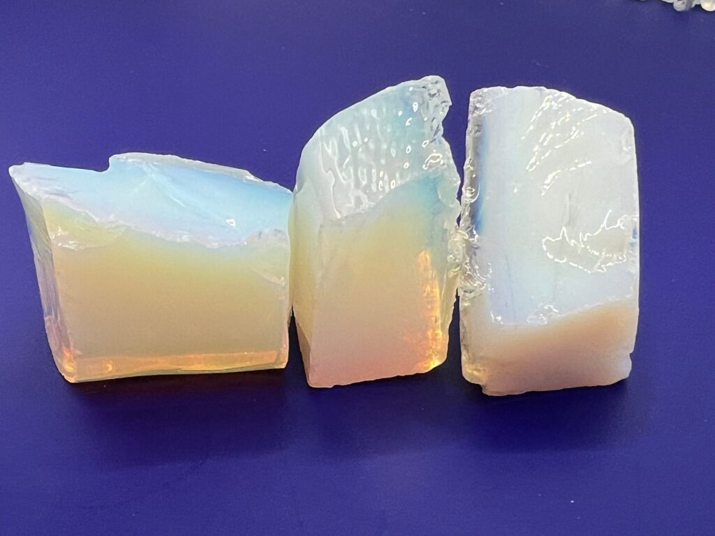 Three pieces of iridescent opal.