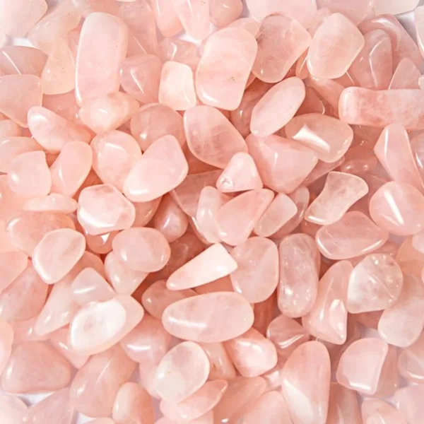 Pink rose quartz tumbled stones.