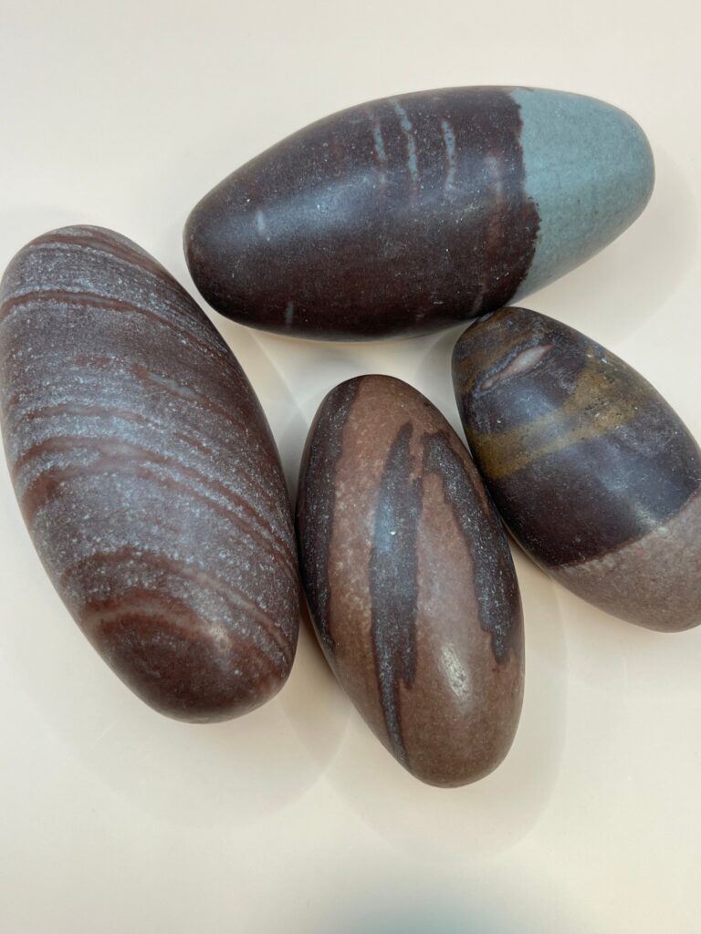 Four brown and gray striped stones.