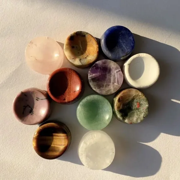 Polished gemstone bowls in various colors.