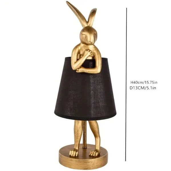 Gold rabbit lamp with black shade.