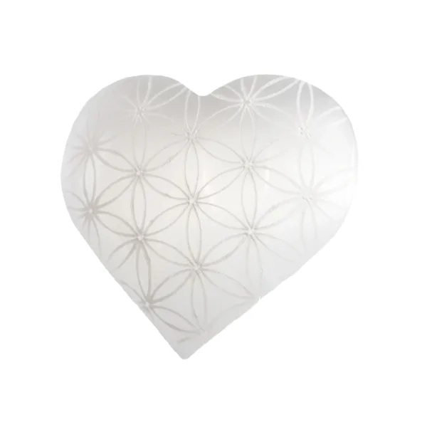 White selenite heart with flower of life pattern.