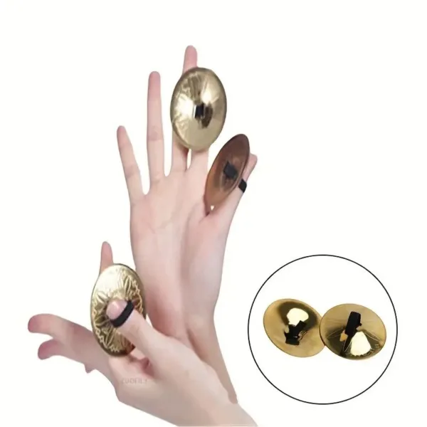 Gold finger cymbals on a hand.