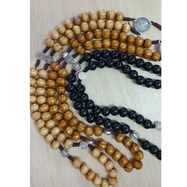 Wooden and black rosary beads with medallions.