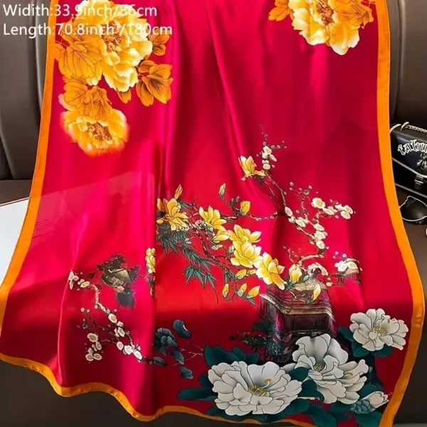 Red silk scarf with floral pattern.