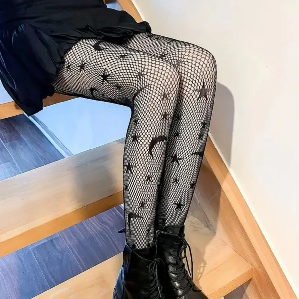 Black fishnet tights with stars and moons.