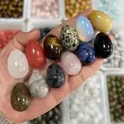 Assortment of colorful gemstone eggs.