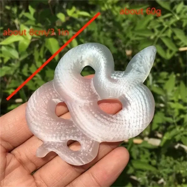 White iridescent snake stone sculpture.