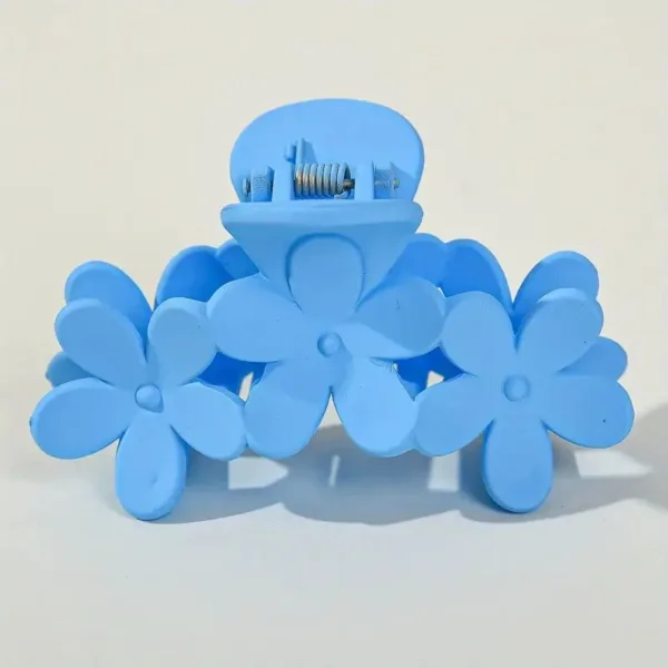 Blue plastic flower hair claw clip.