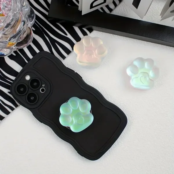 Black phone case with paw print pop socket.