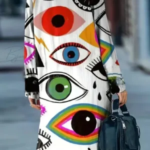 Woman in eye print dress with bag.