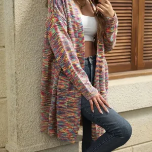 Woman wearing a colorful knit cardigan.