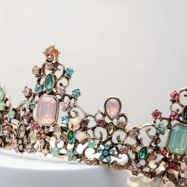 Ornate jeweled crown with pink gems.