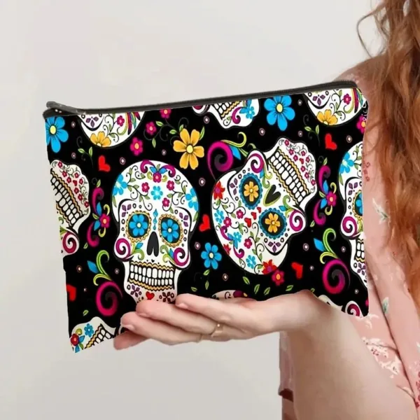 Black and white skull makeup bag with colorful flowers.