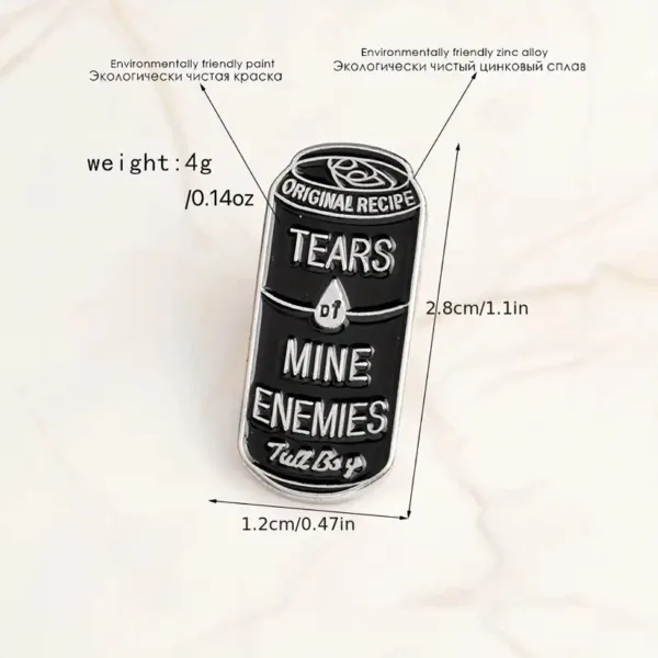 Black and silver pin of a can that says "Tears of my enemies"