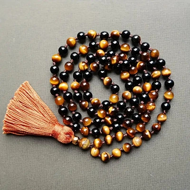 Black and tiger eye beaded necklace with tassel.