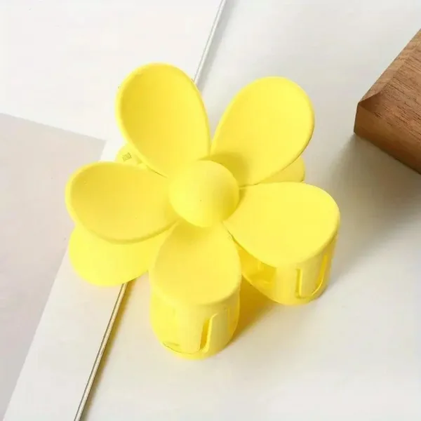 Yellow flower shaped hair clip.