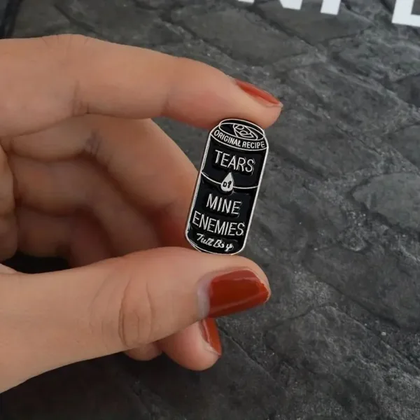 Black can pin with "Tears of Mine Enemies" text.