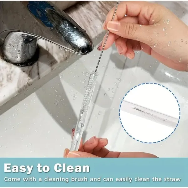 Hand cleaning a clear straw with a brush.