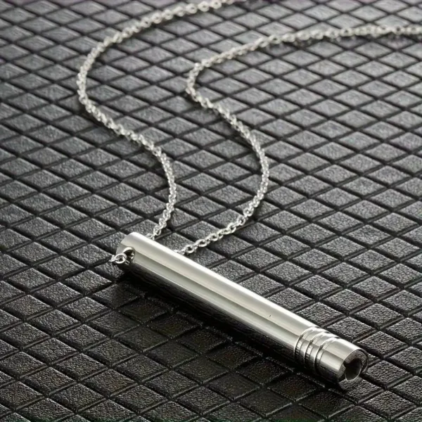 Silver necklace with a cylindrical pendant.