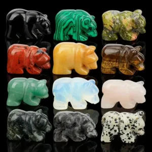 Twelve carved gemstone bear figurines.