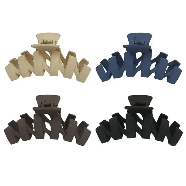 Set of four plastic hair claw clips.