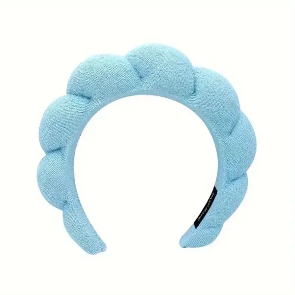 Blue padded headband with a bow.