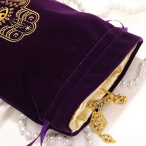 Purple velvet bag with gold hamsa hand