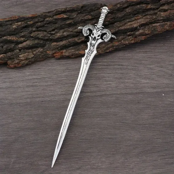 Silver ornate sword on wood background.