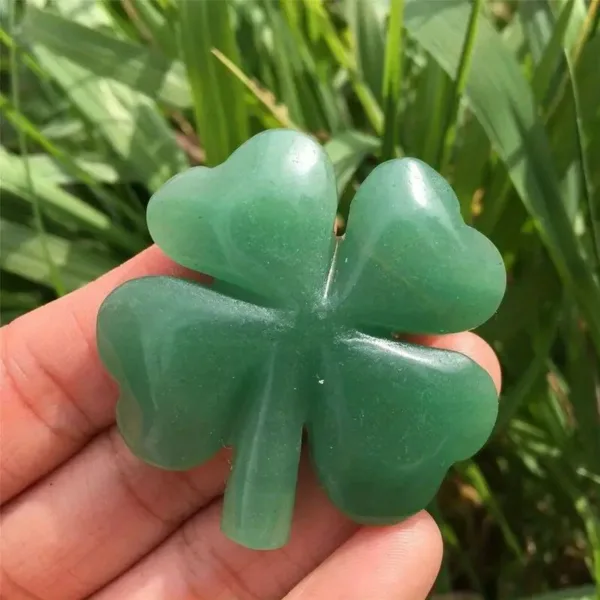 Green four-leaf clover carved from stone.