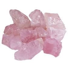 A pile of pink rose quartz crystals.