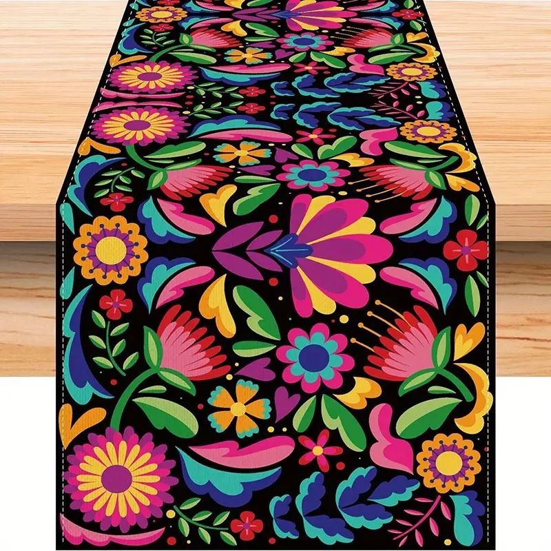 Colorful floral table runner with black background.