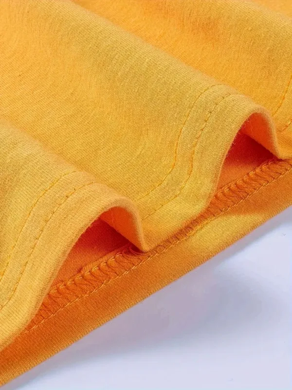 Close up of yellow fabric seam.