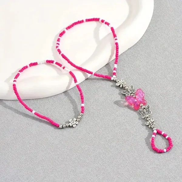 Pink and white beaded anklet with butterflies.