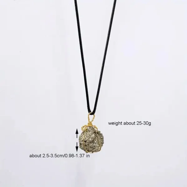 Gold pyrite stone necklace on black cord.