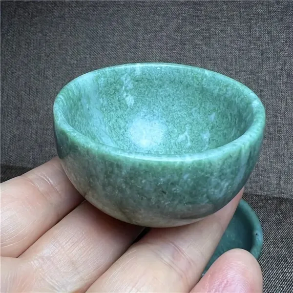 Green marble bowl in hand.