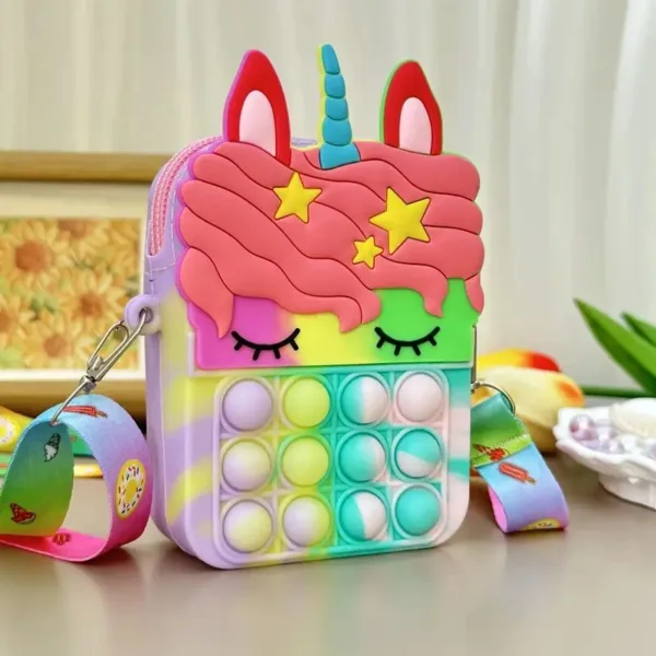 Rainbow unicorn pop it purse with strap.