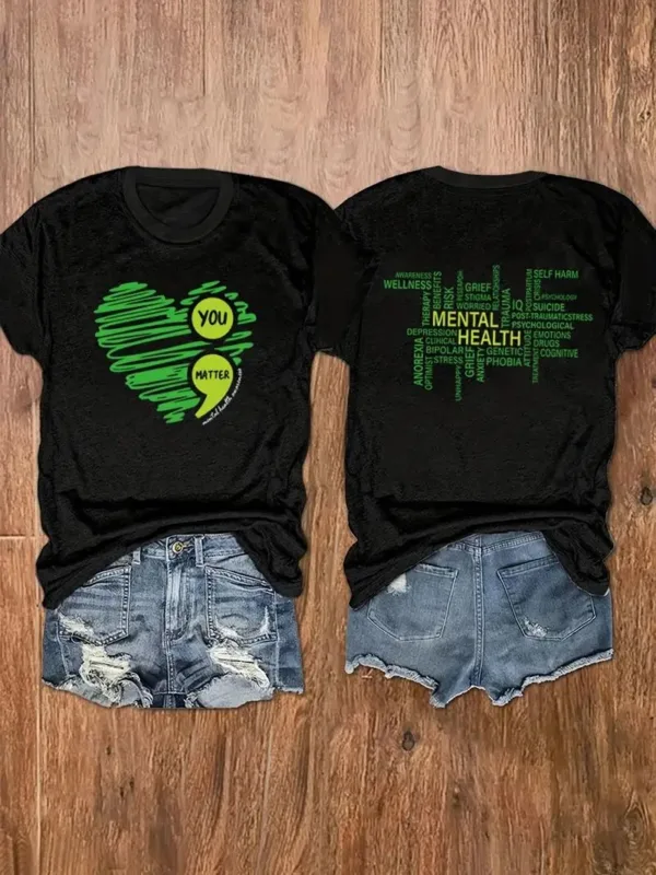 Black shirts with green heart and text.