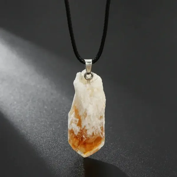 Citrine crystal pendant on black cord necklace.