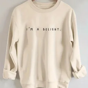 Beige sweatshirt with "I'm a delight" text.