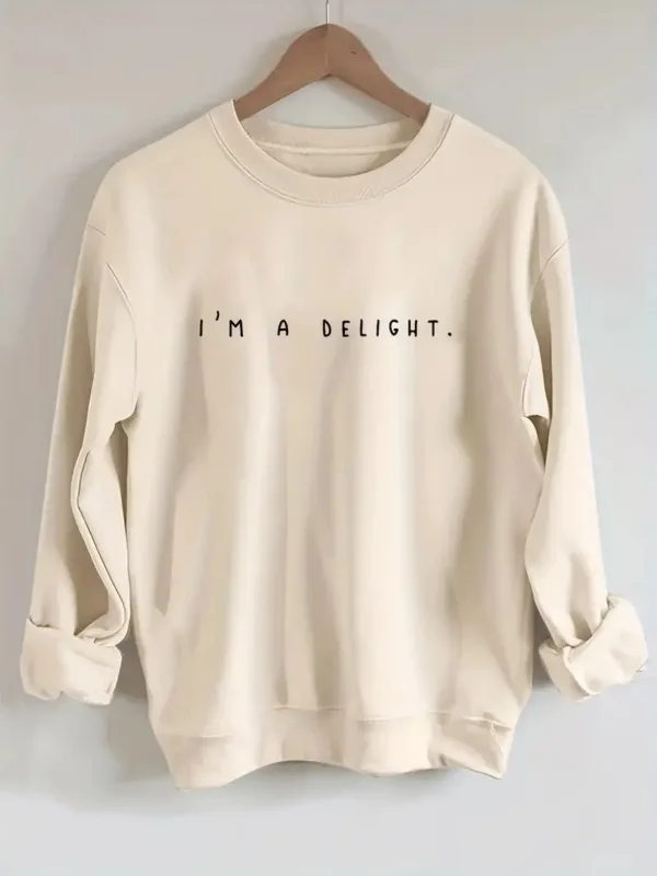 Beige sweatshirt with "I'm a delight" text.