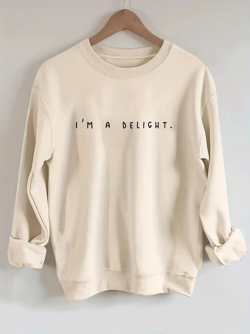 Beige sweatshirt with "I'm a delight" text.