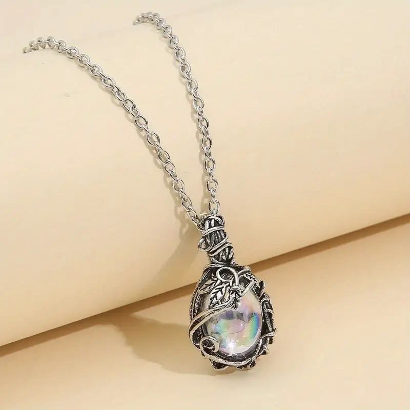 Silver chain necklace with iridescent gemstone pendant.