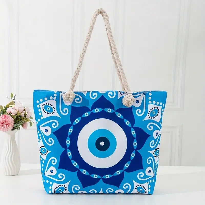 Blue evil eye mandala tote bag