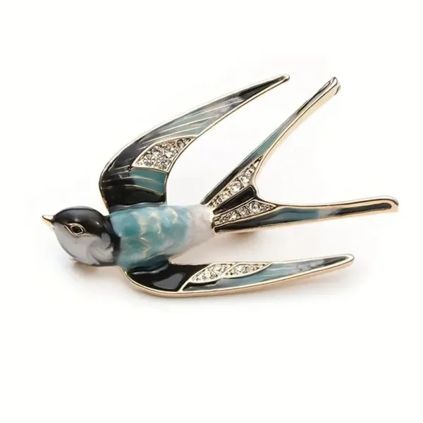 Blue and black jeweled swallow brooch.